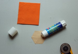 Add a dap of glue to your paper hexagon (this is 7/8